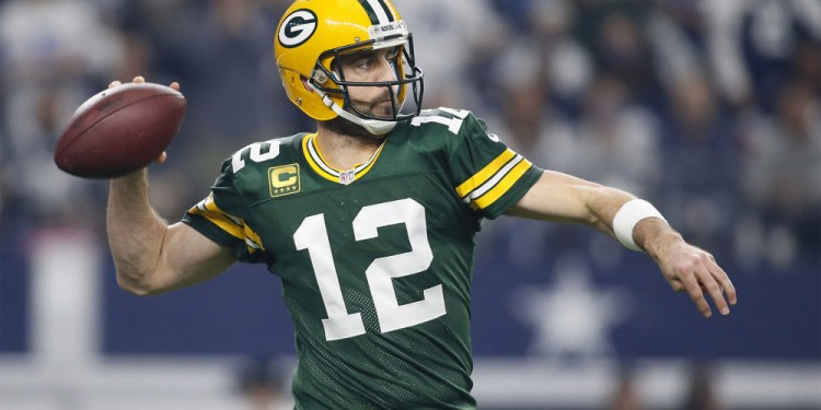 Jan 15, 2017; Arlington, TX, USA; Green Bay Packers quarterback Aaron Rodgers (12) throws a pass during the first quarter against the Dallas Cowboys in the NFC Divisional playoff game at AT&T Stadium. Mandatory Credit: Tim Heitman-USA TODAY Sports