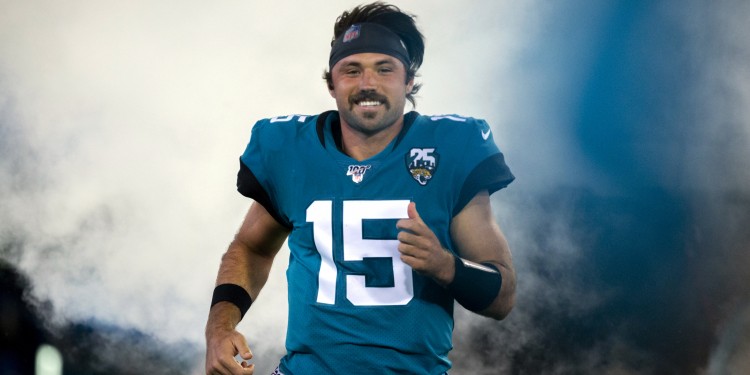 Jacksonville Jaguars quarterback Gardner Minshew (15) runs onto the field during the opening ceremonies of an NFL football game between the Jacksonville Jaguars and the Tennessee Titans, Thursday, Sept. 19, 2019, in Jacksonville, Fla. (AP Photo/Stephen B. Morton)